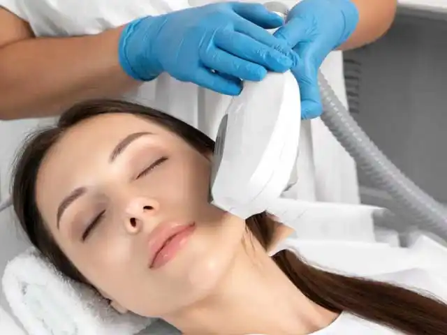 Dermatologist performing laser skin rejuvenation treatment at The National Skin Centre, New Delhi